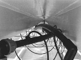 Liquid carbon dioxide distribution pipes located below raised trough system.