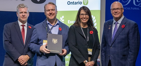 Minister Rob Flack and PA John Jordan awarding Chris Conway and Isabel Dopta with the Supply Chain  Excellence category Honourable Mention certificate.