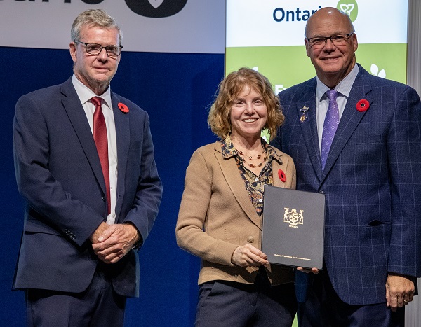 Minister Rob Flack and PA John Jordan awarding Gabrielle Ferguson with the Education Excellence category Honourable Mention certificate.