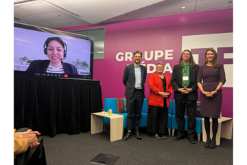 From left to right: panelists Xavier Brassard‑Bédard, CEO of TFO; Marie‑Christine Morin, Executive Director of the Fédération culturelle canadienne‑française; Marcel Morin, Executive Director of the Maison de la francophonie d’Ottawa; and the Honorable Caroline Mulroney, Minister of Francophone Affairs, stand beside a large screen displaying Catalina Briceno, professor at UQAM’s School of Media, during a provincial symposium.